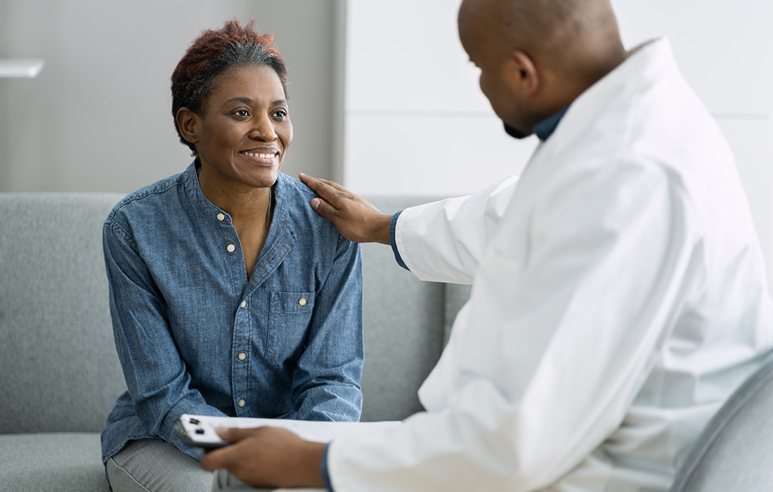 Elderly Woman Consulting Physician